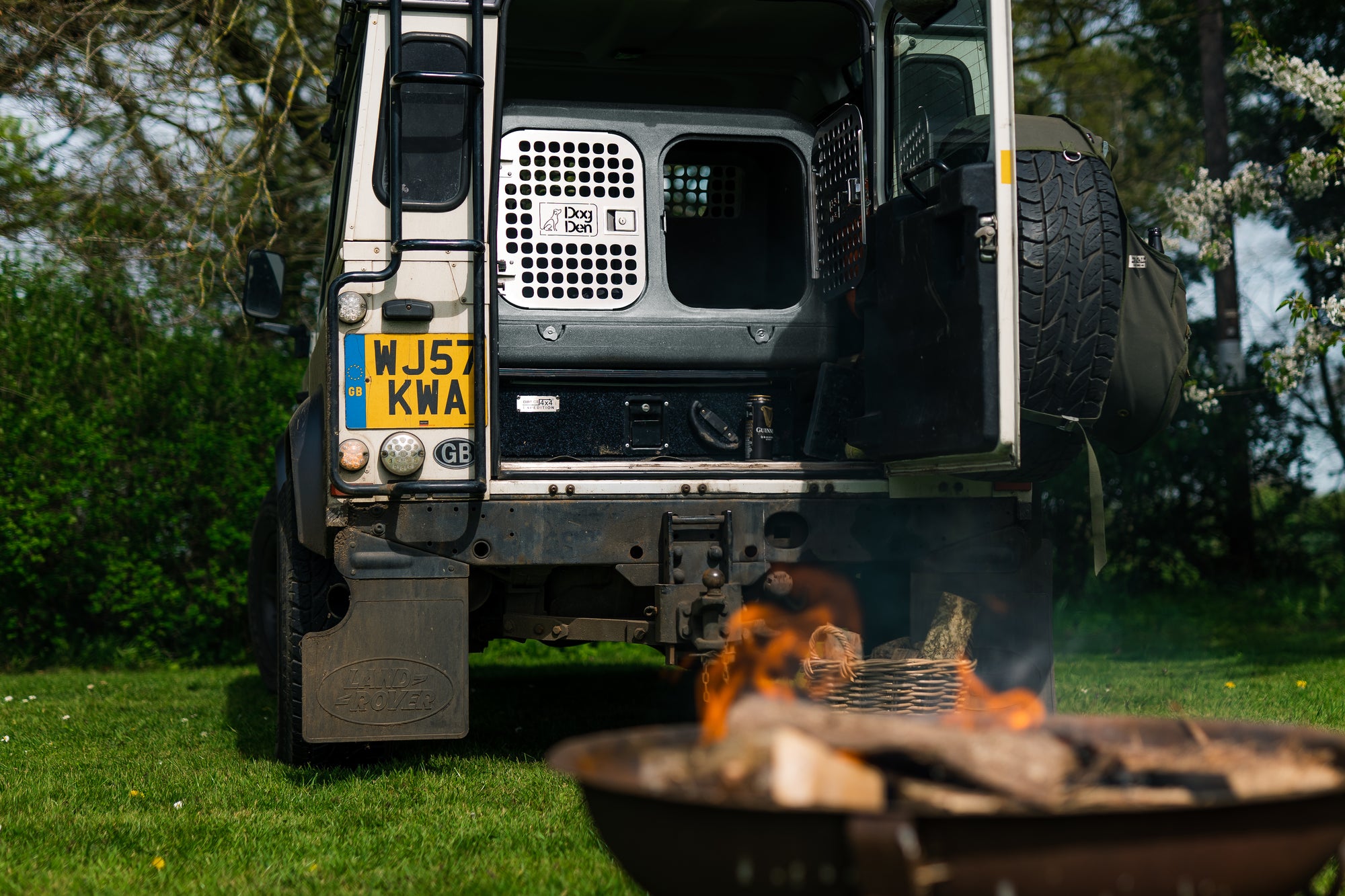 gunmetal silver inside of land rover defender 90 with fire pit